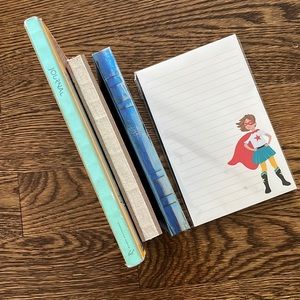 Three journals and a notepad